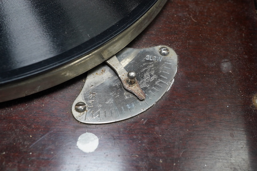 A mahogany cased HMV table top gramophone record player and a small selection of 78 rpm records. Condition - fair to good.